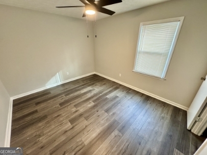 117 Appleton Boulevard Stockbridge, GA 30281 - Photo 6 of 13 a view of an empty room with wooden floor and a window