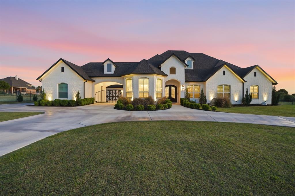 103 Apollo Trail Aurora, TX 76078 - Photo 1 of 40 French provincial home with a front lawn and curved driveway