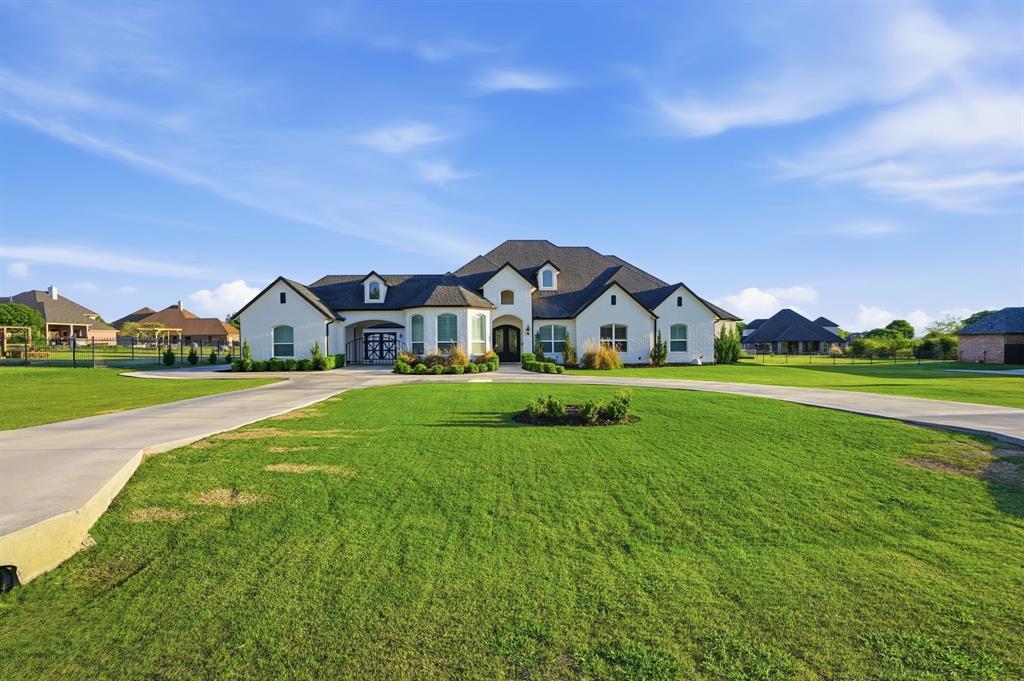 103 Apollo Trail Aurora, TX 76078 - Photo 2 of 40 French provincial home featuring a front lawn and curved driveway