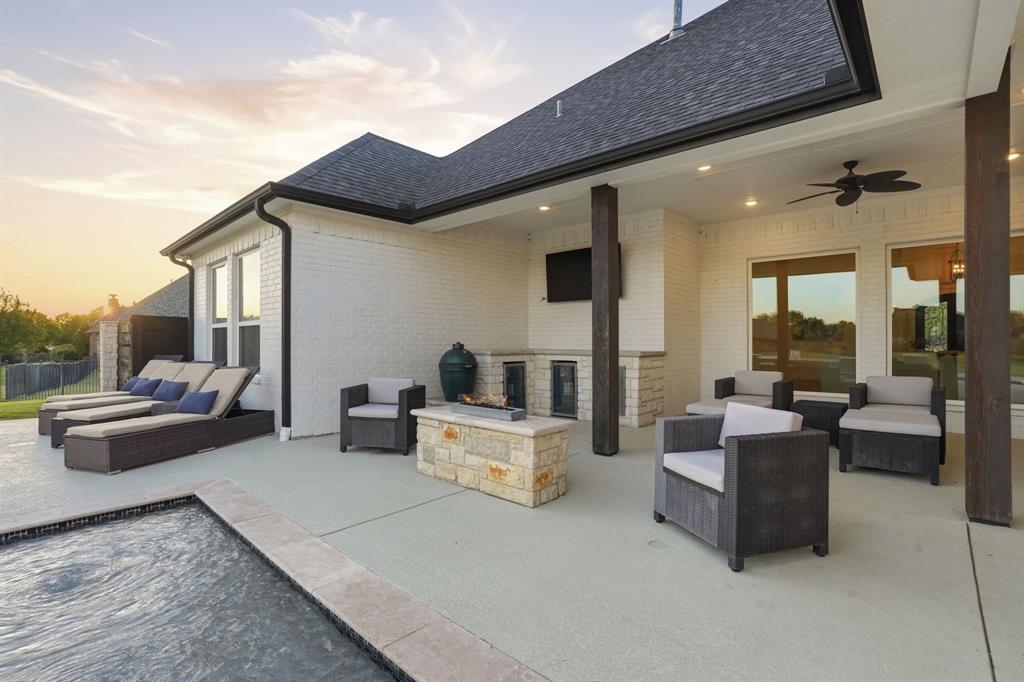103 Apollo Trail Aurora, TX 76078 - Photo 29 of 40 Patio terrace at dusk featuring an outdoor living space with a fire pit, a patio area, and ceiling fan