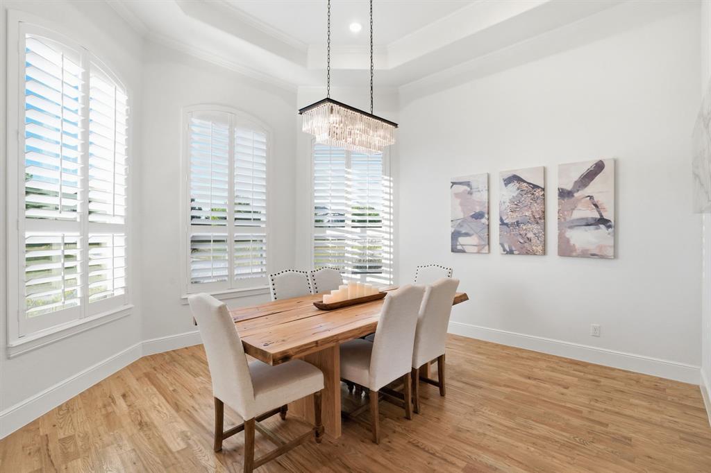103 Apollo Trail Aurora, TX 76078 - Photo 5 of 40 Dining space featuring light wood-style floors, a raised ceiling, and crown molding