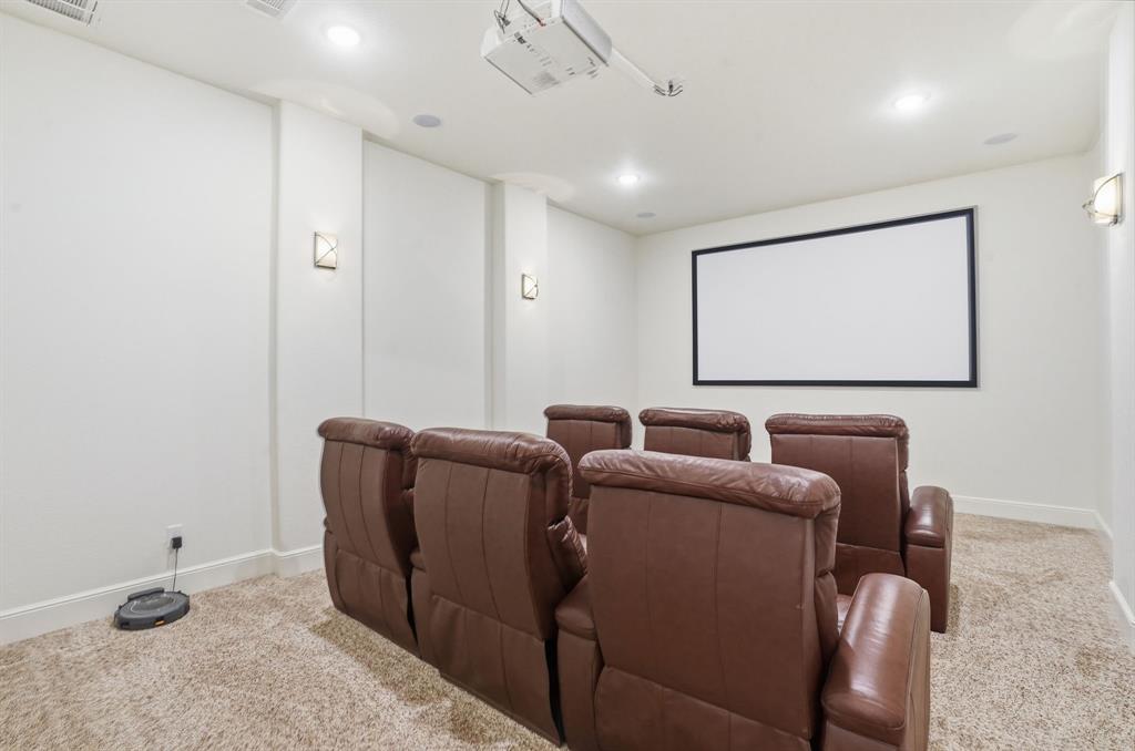 103 Apollo Trail Aurora, TX 76078 - Photo 8 of 40 Home theater with light colored carpet and recessed lighting