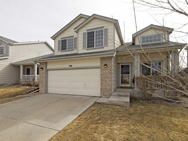 946 Riddlewood Lane Highlands Ranch, CO 80129 - Photo 1 of 1 front view of a house with a yard