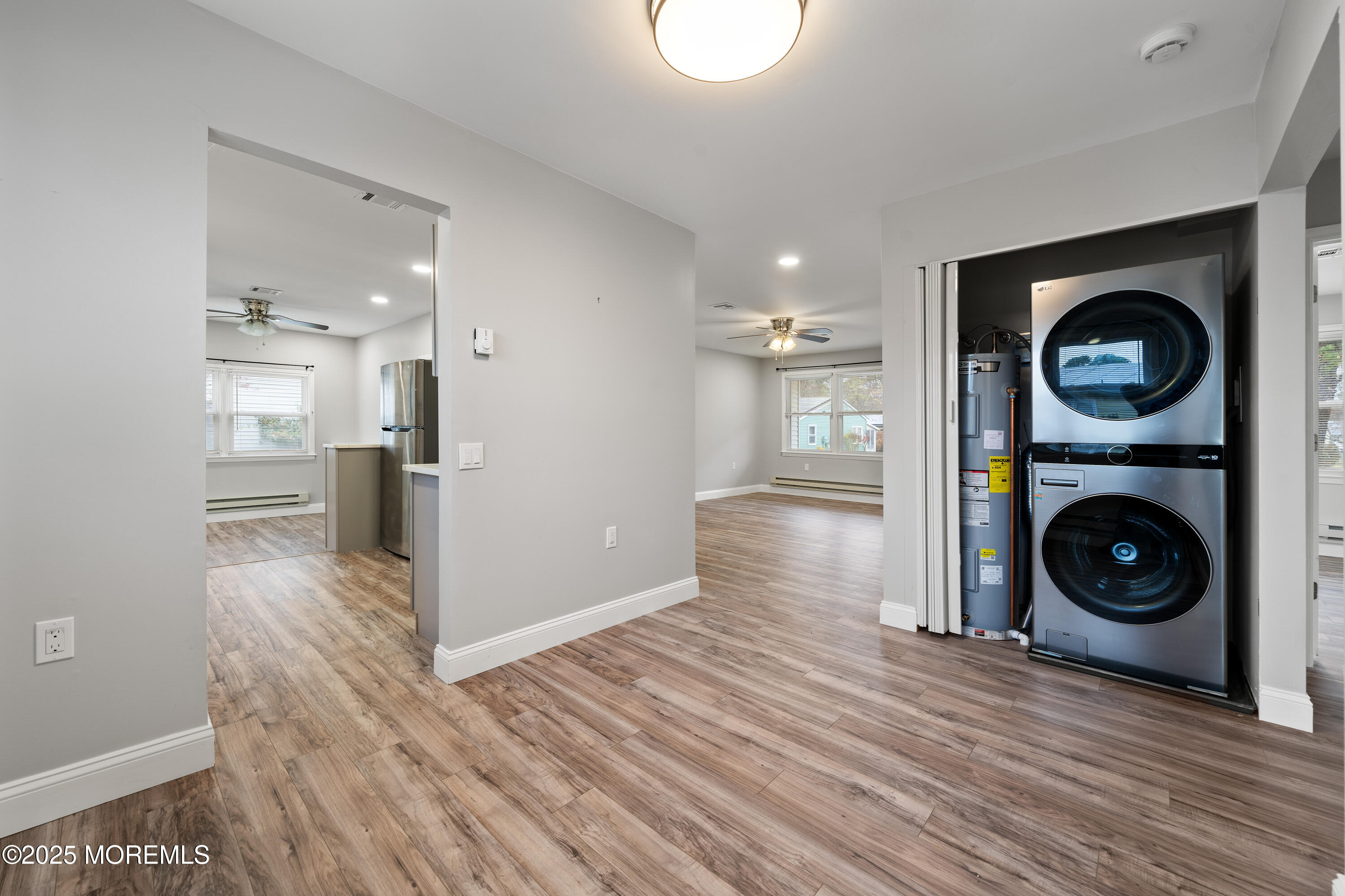 81 Falmouth Avenue, Unit 72 Whiting, NJ 08759 - Photo 12 of 20 a view of a kitchen with a stove wooden cabinets and wooden floor