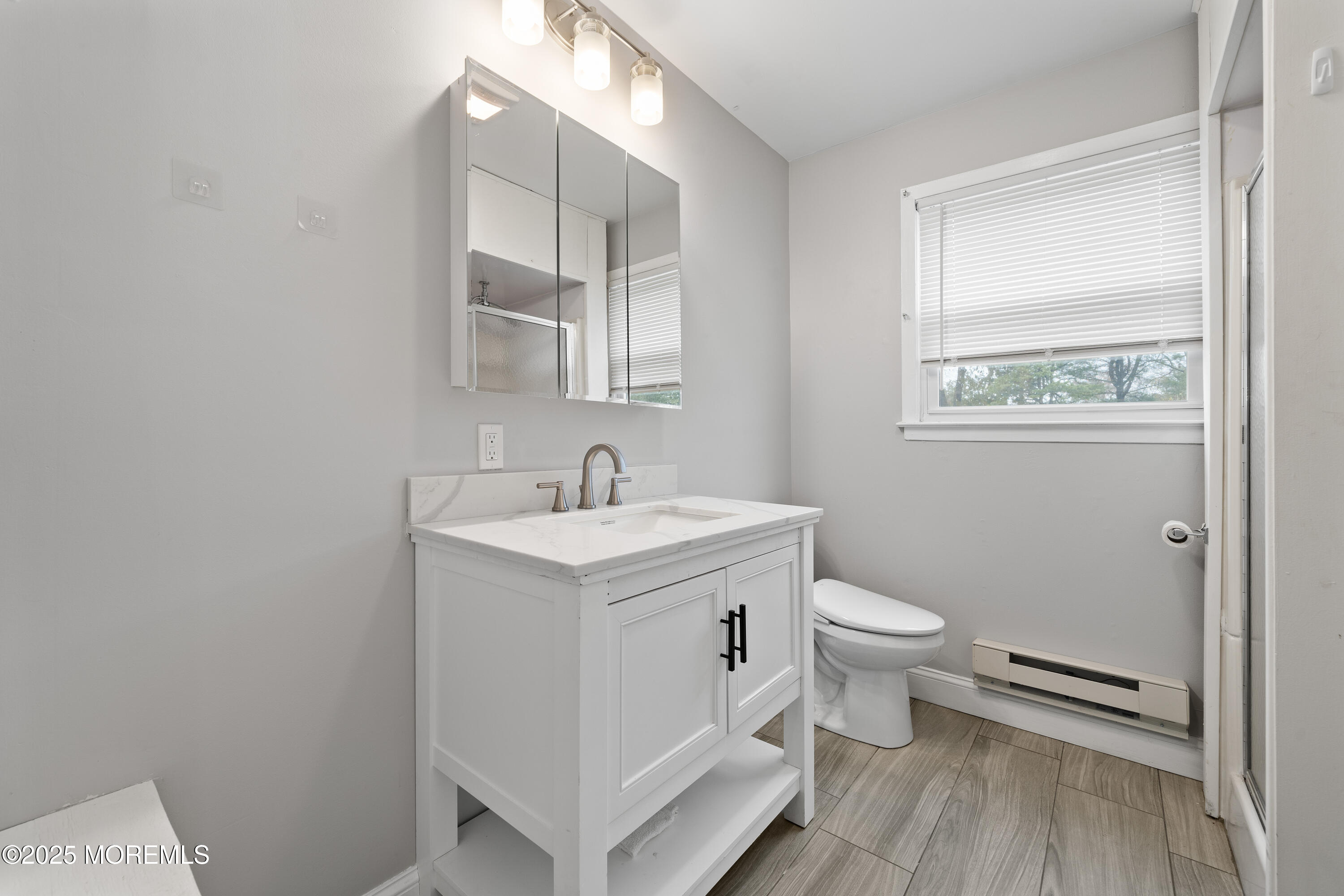 81 Falmouth Avenue, Unit 72 Whiting, NJ 08759 - Photo 17 of 20 a white toilet sitting next to a bathroom sink