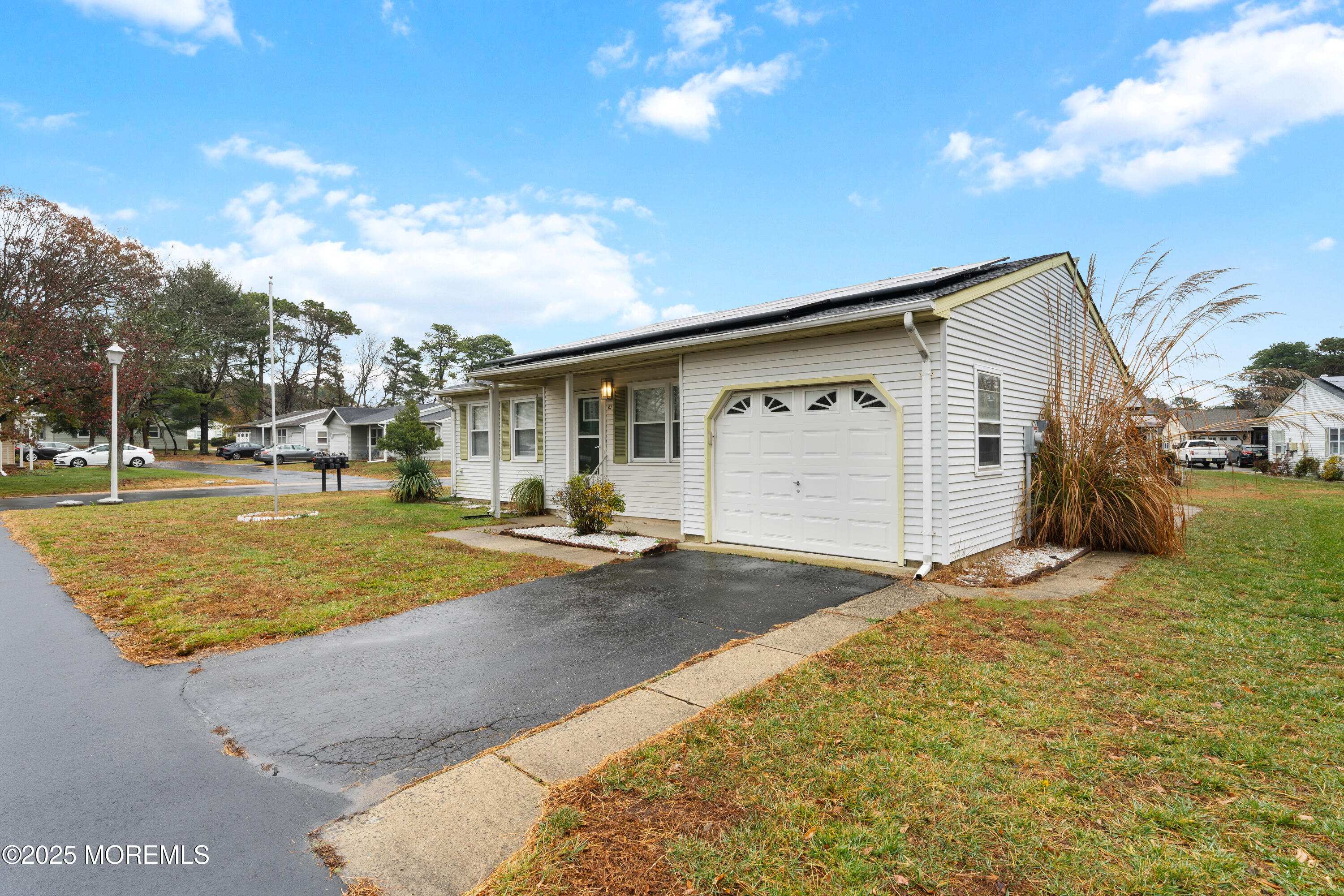 81 Falmouth Avenue, Unit 72 Whiting, NJ 08759 - Photo 19 of 20 a view of a house with basketball court