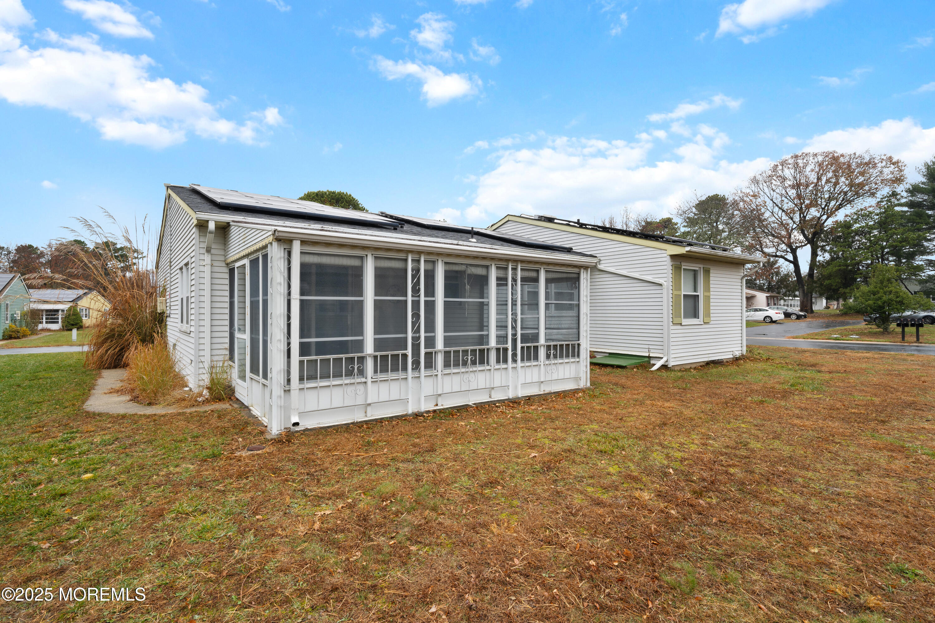 81 Falmouth Avenue, Unit 72 Whiting, NJ 08759 - Photo 20 of 20 a view of a house with a yard