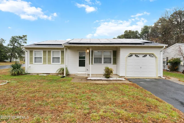 a house that has garden in front of it