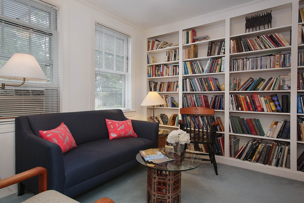 165 Collins Road Newton, MA 02468 - Photo 5 of 11 a living room with furniture and a book shelf