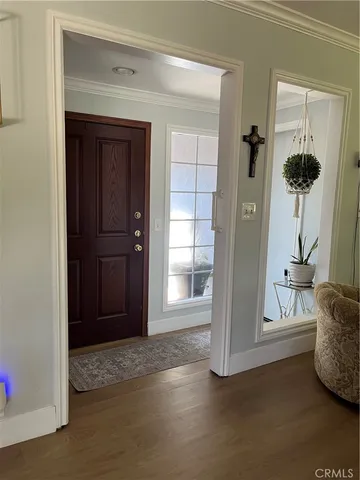 a living room with furniture and flowers