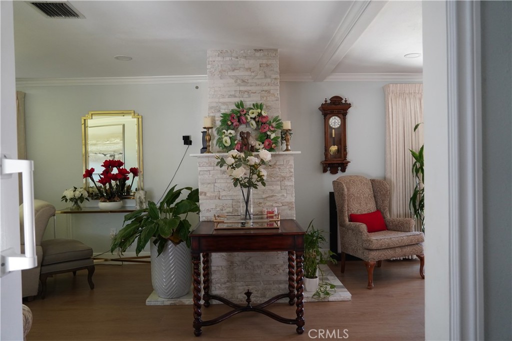 2454 Beacon Street Fullerton, CA 92835 - Photo 12 of 53 a living room with furniture and flowers