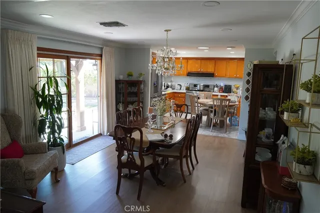 a kitchen with stainless steel appliances granite countertop a refrigerator a sink a stove and island