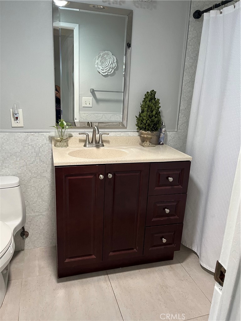 2454 Beacon Street Fullerton, CA 92835 - Photo 24 of 53 a bathroom with a sink and a mirror