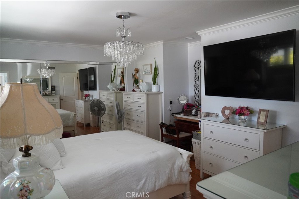 2454 Beacon Street Fullerton, CA 92835 - Photo 31 of 53 a bedroom with a bed and a flat screen tv