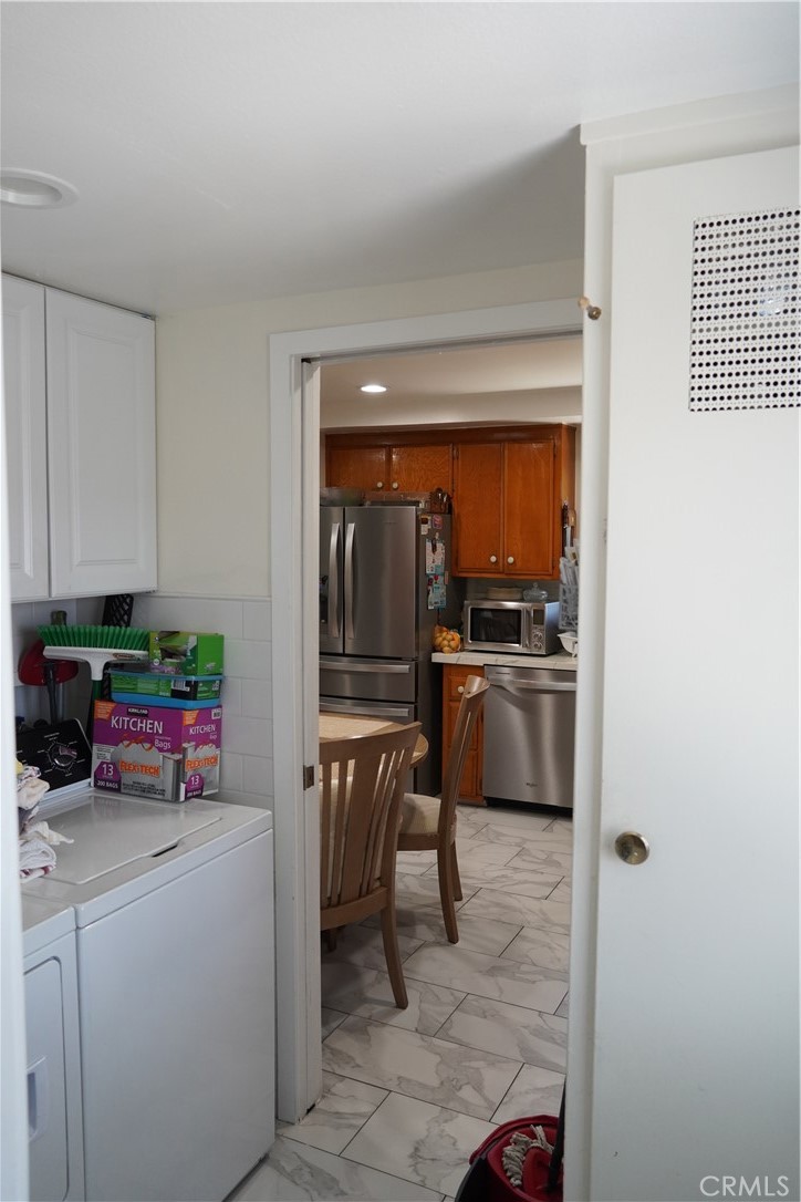 2454 Beacon Street Fullerton, CA 92835 - Photo 38 of 53 a kitchen with a sink cabinets and stainless steel appliances