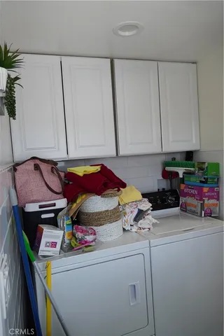 a view of a patio with table and chairs and potted plants