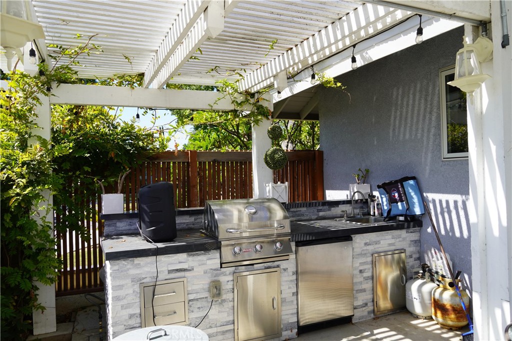 2454 Beacon Street Fullerton, CA 92835 - Photo 42 of 53 a view of outdoor kitchen outdoor dining space and furniture
