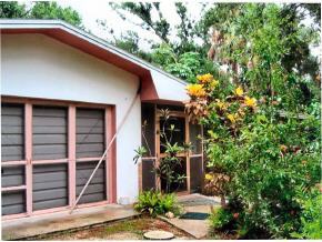 6686 Flamingo Court Melbourne Village, FL 32904 - Photo 4 of 12 a house with trees in front of it