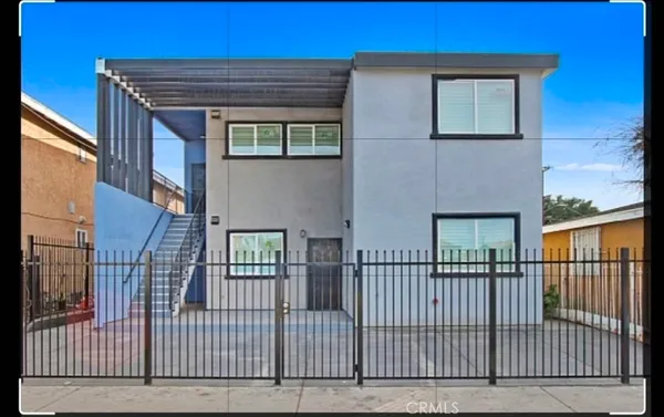 front view of a brick house with a large window