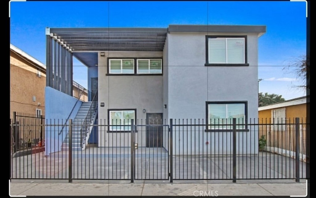 front view of a brick house with a large window