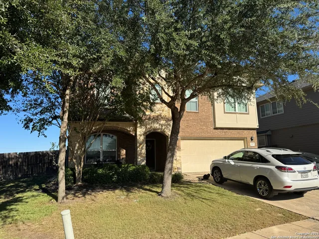 a view of a car parked in front of a house