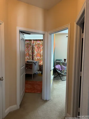 a view of a room that has a bed and a window