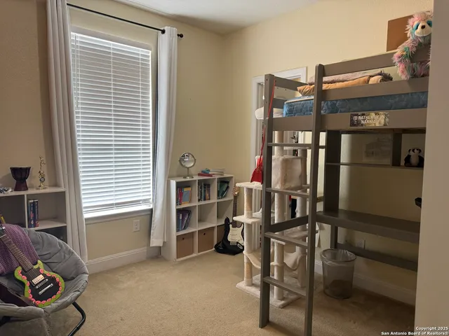 a view of room with furniture and a window