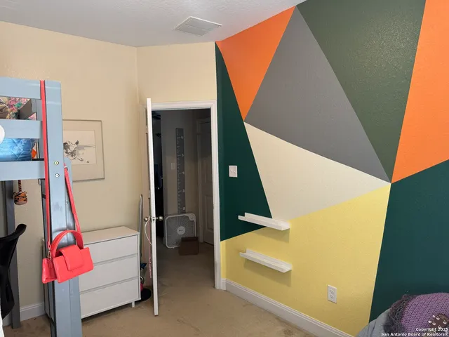 a view of living room with baby crib