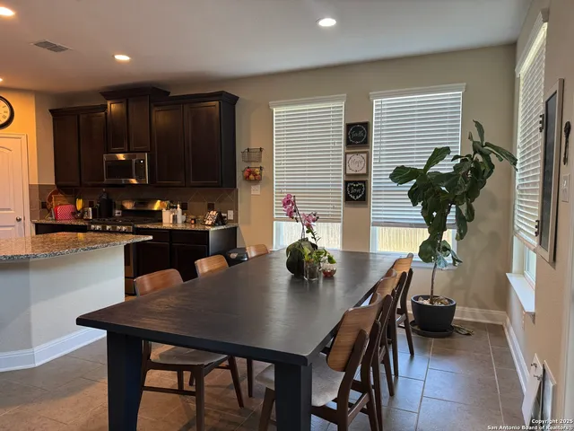 a view of a dining room with furniture