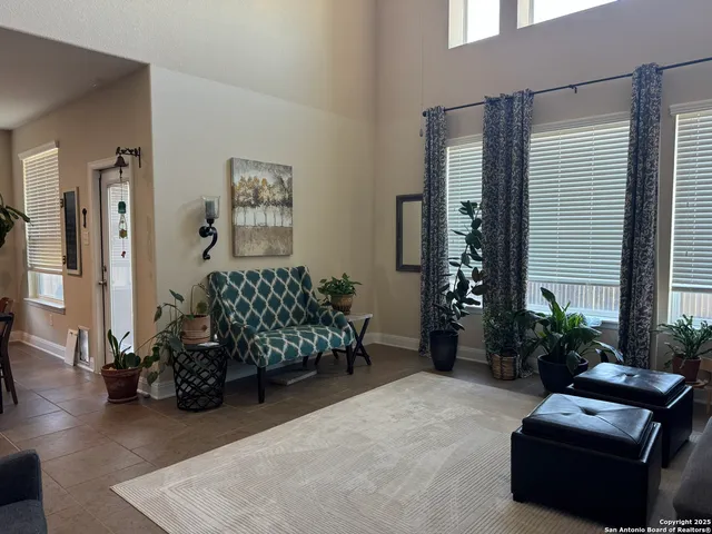 a bedroom with furniture and a potted plant