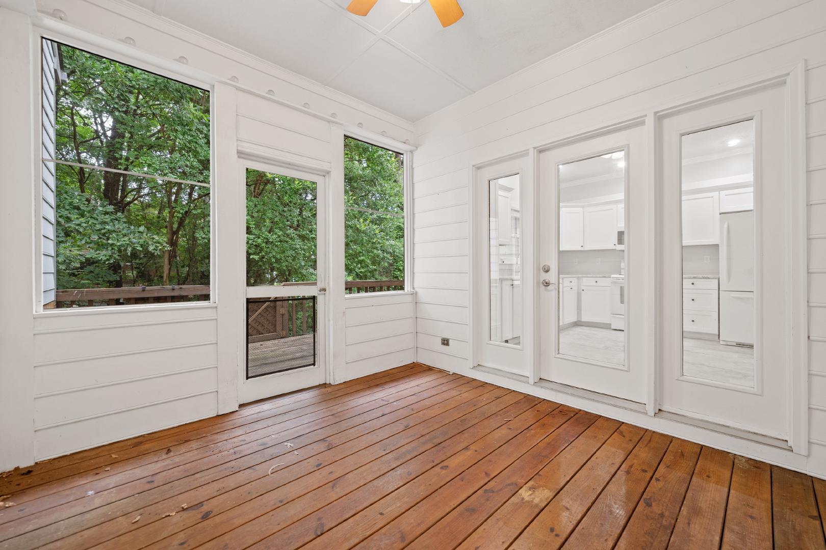4111 Settlement Drive Durham, NC 27713 - Photo 14 of 16 a view of an empty room with wooden floor and a window