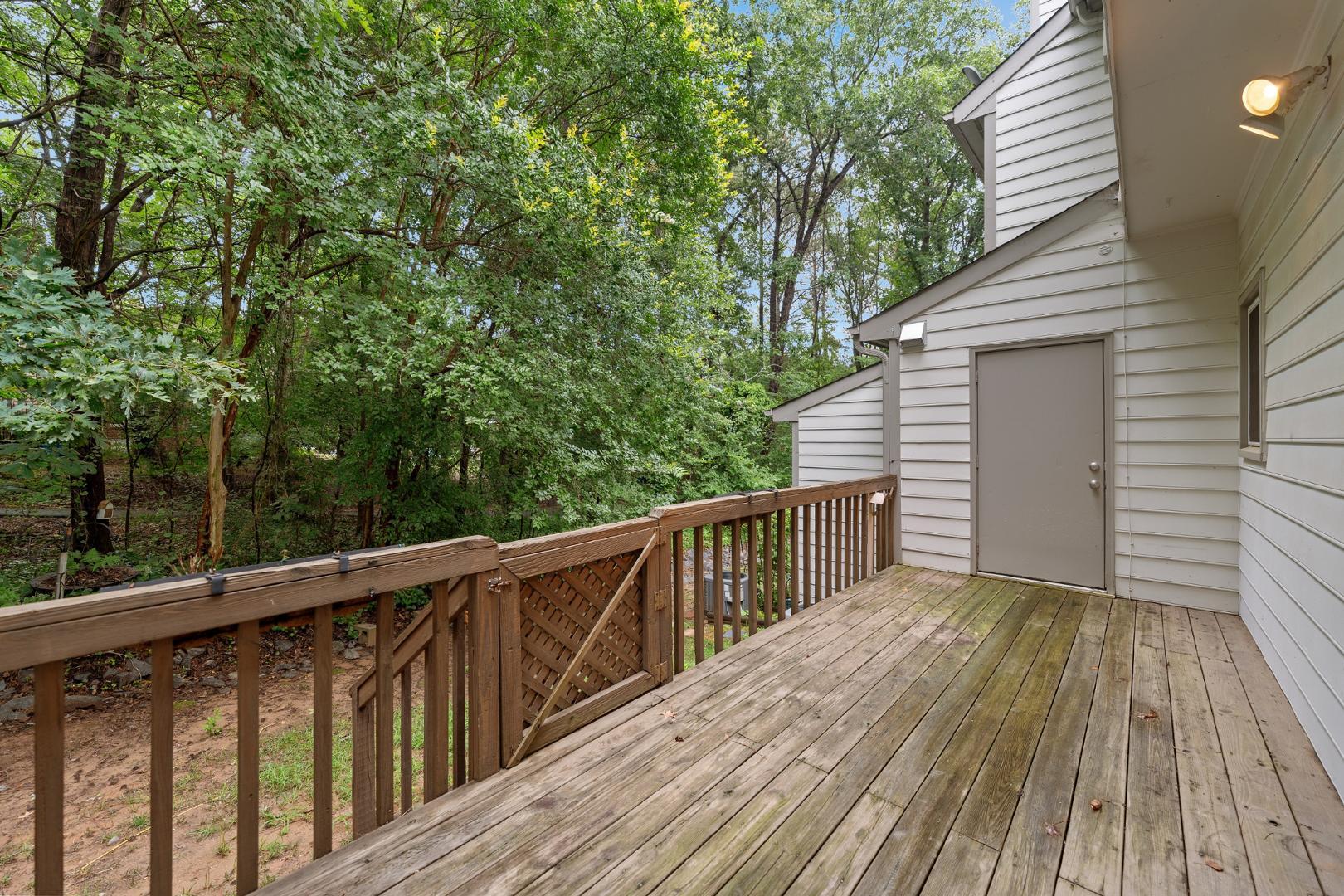 4111 Settlement Drive Durham, NC 27713 - Photo 15 of 16 a view of deck with wooden floor and fence