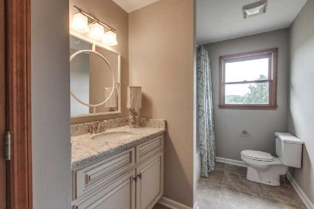 5603 Rucker Christiana Road Christiana, TN 37037 - Photo 9 of 20 Hall Bath with tub/shower combo. New cabinetry, granite, faucets and lighting.