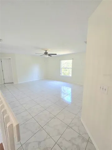 a view of empty room with windows