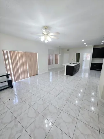 a view of a livingroom with furniture and cabinets