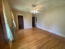 446 Chandler Street, Unit 2 Worcester, MA 01602 - Photo 11 of 11 a view of a livingroom with a chandelier