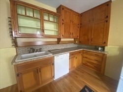 446 Chandler Street, Unit 2 Worcester, MA 01602 - Photo 2 of 11 a kitchen with a sink and a window
