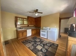 446 Chandler Street, Unit 2 Worcester, MA 01602 - Photo 4 of 11 a kitchen with stainless steel appliances granite countertop a sink stove and refrigerator