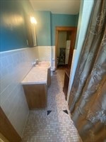 446 Chandler Street, Unit 2 Worcester, MA 01602 - Photo 9 of 11 a bathroom with a bathtub