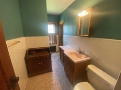 446 Chandler Street, Unit 2 Worcester, MA 01602 - Photo 10 of 11 a room with furniture and a mirror