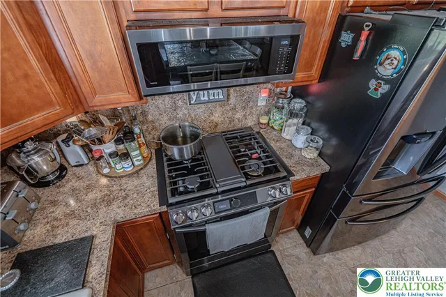 a kitchen with a stove and a microwave
