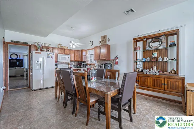 a dining area with furniture and window