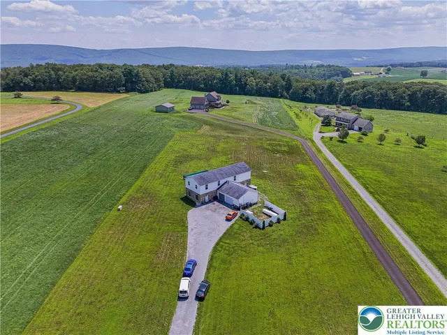 a view of a lake with a yard