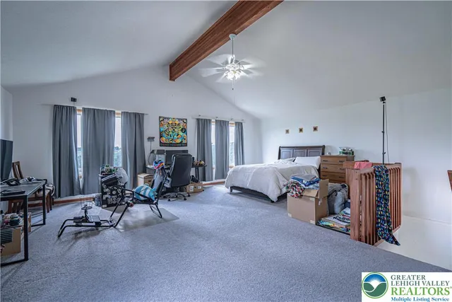 a bedroom with furniture and a gym equipment