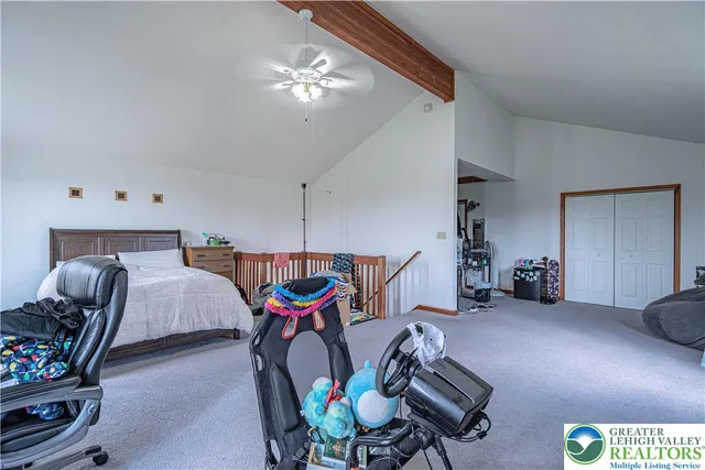 a bedroom with furniture and a chandelier