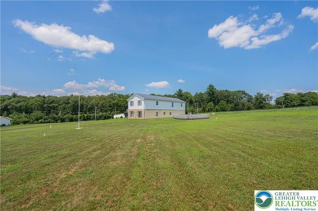 a view of a yard with a table and a chair