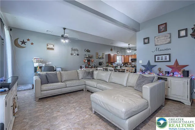 a living room with furniture and a couch