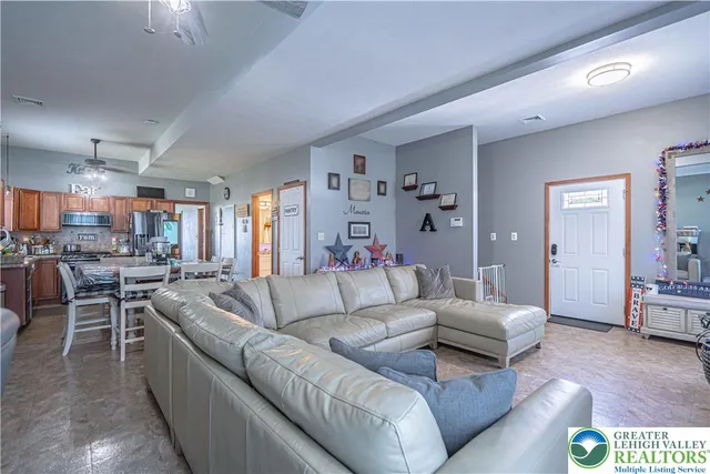 a living room with furniture and a table