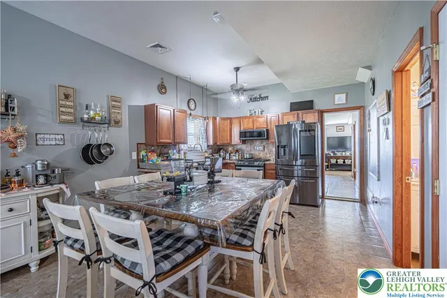a view of a dining room with furniture and window