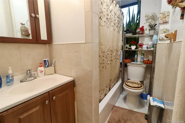 a kitchen with stainless steel appliances a stove microwave and refrigerator